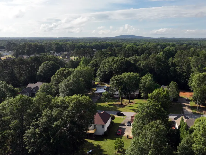 Aerial view of home in need of damage restoration services in Powder Springs